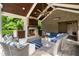 Cozy outdoor living room features a stone fireplace, comfortable seating, and stylish decor, perfect for gatherings at 2870 Redding Ne Rd, Atlanta, GA 30319