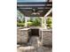 Spacious outdoor kitchen with stone countertops, built-in appliances, and a bar area, great for entertaining at 2870 Redding Ne Rd, Atlanta, GA 30319