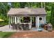 Outdoor kitchen boasts a built-in bar, high-end grill, and ample counter space for outdoor cooking at 2870 Redding Ne Rd, Atlanta, GA 30319
