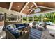 Comfortable outdoor space with plush seating, a ceiling fan, and a view of the refreshing pool and landscape at 2870 Redding Ne Rd, Atlanta, GA 30319