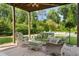 Relaxing patio with wicker furniture overlooking a beautiful backyard with pool, perfect for outdoor living at 2870 Redding Ne Rd, Atlanta, GA 30319