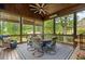 Relaxing screened porch with wood ceiling, dining area, and views of the landscaped backyard at 2870 Redding Ne Rd, Atlanta, GA 30319