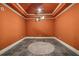 Unique wine cellar features copper colored walls and decorative lighting at 2870 Redding Ne Rd, Atlanta, GA 30319