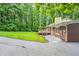 Spacious backyard features a wooden deck perfect for outdoor dining and entertaining at 4201 Hicks Rd, Austell, GA 30106