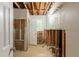A gutted bathroom shows the potential for renovation with a window and doorway at 4201 Hicks Rd, Austell, GA 30106