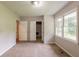 This bedroom has 2 windows and 2 doors with access to a closet and another room at 4201 Hicks Rd, Austell, GA 30106