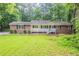 Charming single-story home with a brick facade, complemented by a well-maintained front yard at 4201 Hicks Rd, Austell, GA 30106