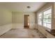 Eat-in kitchen featuring wainscoting, a window view, and an open doorway at 4201 Hicks Rd, Austell, GA 30106