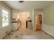 Bright eat-in kitchen with white wainscoting and an open view of the cook space at 4201 Hicks Rd, Austell, GA 30106
