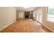 Open living area with hardwood floors and brick fireplace at 4201 Hicks Rd, Austell, GA 30106