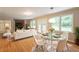 Bright living room with hardwood floors, fireplace, dining area, and access to the backyard at 4201 Hicks Rd, Austell, GA 30106