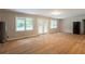 Open-concept area with hardwood floors, a door to the backyard, and modern features at 4201 Hicks Rd, Austell, GA 30106