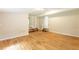Expansive living room with hardwood floors, stair access, and natural light at 4201 Hicks Rd, Austell, GA 30106