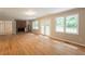 Spacious living room features hardwood floors and a brick fireplace at 4201 Hicks Rd, Austell, GA 30106