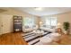 Bright living room with hardwood floors, neutral decor, and ample seating at 4201 Hicks Rd, Austell, GA 30106