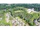Aerial view showcasing the home's location nestled among trees, highlighting its privacy and neighborhood setting at 13055 Fox Rd, Alpharetta, GA 30005