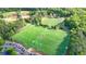 Aerial view of athletic fields adjacent to a wooded area, showing recreational amenities at 13055 Fox Rd, Alpharetta, GA 30005