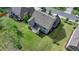 Aerial view of the backyard showing the home's layout, a covered patio, and lush surroundings at 13055 Fox Rd, Alpharetta, GA 30005