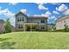 Expansive backyard with a well-maintained lawn, ideal for outdoor activities and entertaining guests at 13055 Fox Rd, Alpharetta, GA 30005