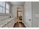 View of butler's pantry leading into elegant dining room at 13055 Fox Rd, Alpharetta, GA 30005