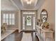 Welcoming foyer with dark hardwood floors and bright natural light at 13055 Fox Rd, Alpharetta, GA 30005