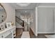 Inviting foyer boasts hardwood floors and a view of the staircase at 13055 Fox Rd, Alpharetta, GA 30005