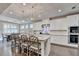 Spacious kitchen featuring a large island with granite countertops, breakfast bar, and stainless steel appliances at 13055 Fox Rd, Alpharetta, GA 30005