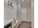 Mudroom features a built-in bench, storage cubbies, and hooks for organization at 13055 Fox Rd, Alpharetta, GA 30005