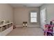Spacious playroom with plenty of room to play, carpeted floor and lots of natural light at 13055 Fox Rd, Alpharetta, GA 30005