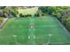 Aerial view of a pristine soccer field with lush green turf and well-maintained sports facility surrounded by trees at 13055 Fox Rd, Alpharetta, GA 30005