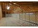 Spacious attic with exposed wooden beams and a skylight, offering potential for customization and ample storage at 140 Moseley Dr, Stockbridge, GA 30281
