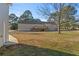 Expansive backyard featuring a well-maintained lawn and wooden deck at 140 Moseley Dr, Stockbridge, GA 30281
