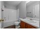 Bathroom featuring a tiled shower, new toilet, and modern vanity at 140 Moseley Dr, Stockbridge, GA 30281