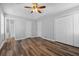 Spacious bedroom features wood-look flooring, a ceiling fan, and a double door closet at 140 Moseley Dr, Stockbridge, GA 30281