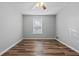 Comfortable bedroom features wood-look flooring and ample natural light at 140 Moseley Dr, Stockbridge, GA 30281