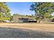 Ranch style home on a large lot with mature trees surrounding the home at 140 Moseley Dr, Stockbridge, GA 30281