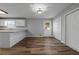 Eat-in kitchen with modern finishes and ample storage space, including access to the laundry room at 140 Moseley Dr, Stockbridge, GA 30281