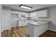 Eat-in kitchen features white cabinets, modern appliances, and durable countertops at 140 Moseley Dr, Stockbridge, GA 30281