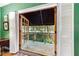 Balcony with wrought iron railing offering views of garden at 3456 Paces Nw Pl, Atlanta, GA 30327