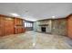 Spacious basement features a stone fireplace, wood cabinets and travertine floors at 3456 Paces Nw Pl, Atlanta, GA 30327