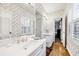 Well lit bathroom with a spacious counter area, wallpapered walls, and access to another room at 3456 Paces Nw Pl, Atlanta, GA 30327