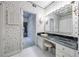 Bathroom vanity with marble counter tops, and an ensuite bathroom with ample closet storage at 3456 Paces Nw Pl, Atlanta, GA 30327