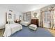 Bedroom features two twin beds, floral curtains, blue carpet, and a vintage aesthetic at 3456 Paces Nw Pl, Atlanta, GA 30327
