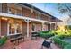 Brick courtyard with covered patio and landscaped features at 3456 Paces Nw Pl, Atlanta, GA 30327