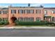 Beautiful two-story brick townhome with black shutters and a covered entry at 3456 Paces Nw Pl, Atlanta, GA 30327
