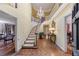 Grand foyer with a curved staircase, chandelier, and hardwood floors at 3456 Paces Nw Pl, Atlanta, GA 30327
