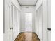 Hallway with hardwood floors and closet doors at 3456 Paces Nw Pl, Atlanta, GA 30327