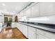 Spacious kitchen with white cabinets, granite countertops, and a breakfast nook at 3456 Paces Nw Pl, Atlanta, GA 30327