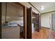 Laundry room features laminate wood floors, washer, dryer and storage cabinets at 3456 Paces Nw Pl, Atlanta, GA 30327