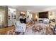 Spacious living room with fireplace, built-in shelving, and an ornate area rug on the parquet wood floor at 3456 Paces Nw Pl, Atlanta, GA 30327